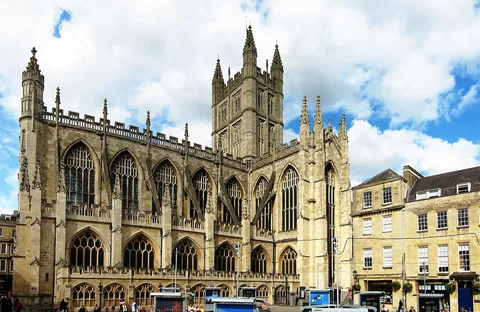 Bath Abbey exterior with its tall windows, pinnacles and square crossing tower