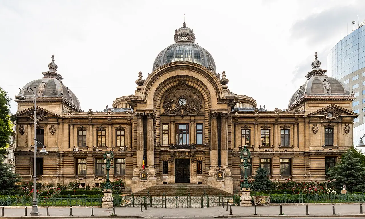 The domes and large central entrance arch of CEC Palace on Calea Victoriei