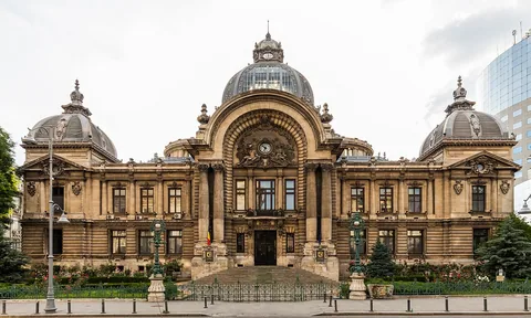 The domes and large central entrance arch of CEC Palace on Calea Victoriei