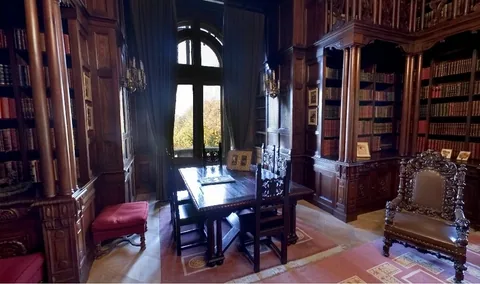 Wooden bookcases and the upper gallery in Ferdinand’s library at Cotroceni Palace.