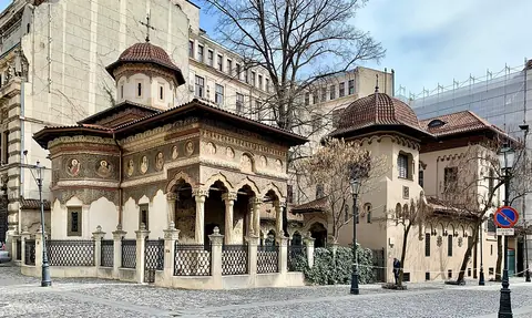 The carved porch and painted exterior of Stavropoleos church in Bucharest