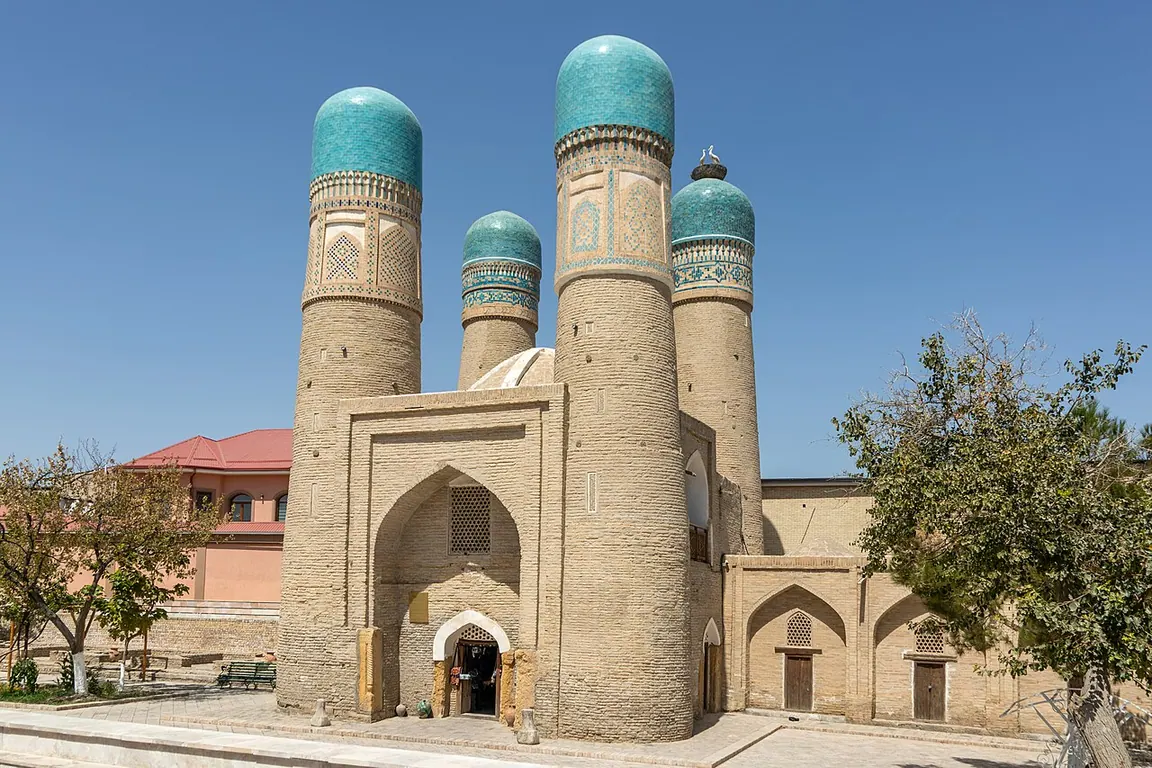 Chor Minor gatehouse in Bukhara, with four turquoise-capped corner towers.