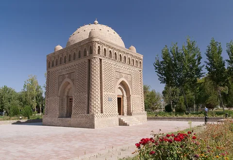 The brick Samanid Mausoleum, showing its patterned walls, arched openings and dome.