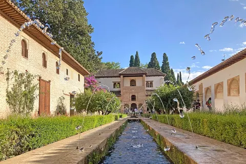 Crossing water jets over the long canal in the Patio de la Acequia at the Generalife in Granada.