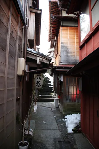 A narrow lane between traditional buildings in Kazuemachi