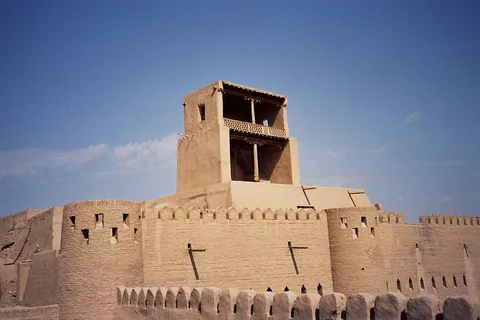 The two-level lookout rising above the thick earthen walls of Kunya Ark in Khiva.