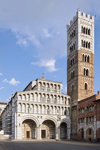 Marble facade and tall bell tower of the Cathedral of San Martino in Lucca