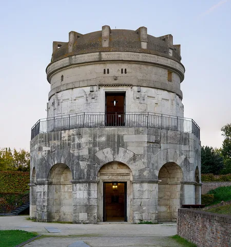 Two pale stone levels of the Mausoleum of Theodoric beneath its single-stone roof