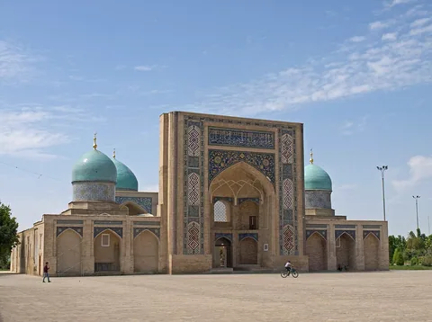 The tiled portal and domes of Barak Khan Madrasah in Tashkent’s Khast Imam complex.