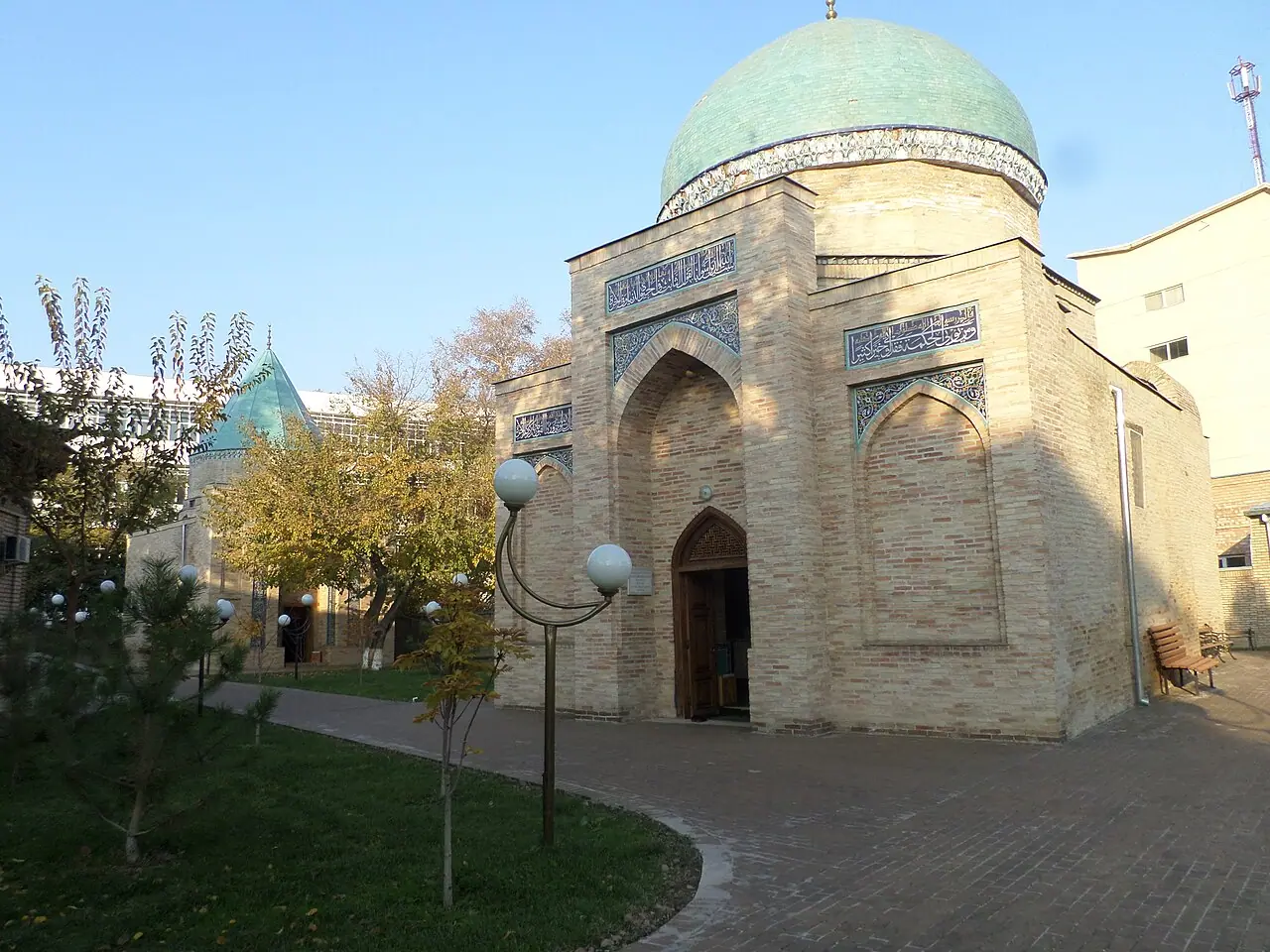 The brick façade and rounded dome of the Sheikh Hovendi at-Tahur mausoleum in Tashkent.
