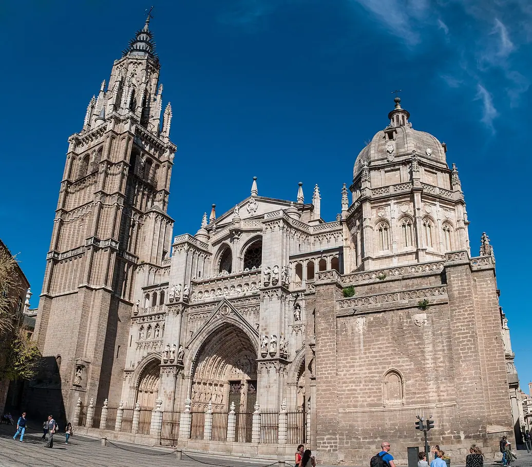 Toledo Cathedral’s main facade, with its tall bell tower on the left and domed chapel on the right.