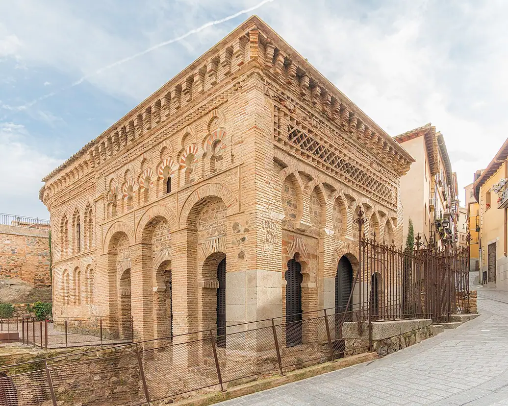 Brick arcades and geometric decoration on the square former mosque of Cristo de la Luz in Toledo.