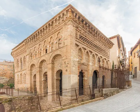 Brick arcades and geometric decoration on the square former mosque of Cristo de la Luz in Toledo.