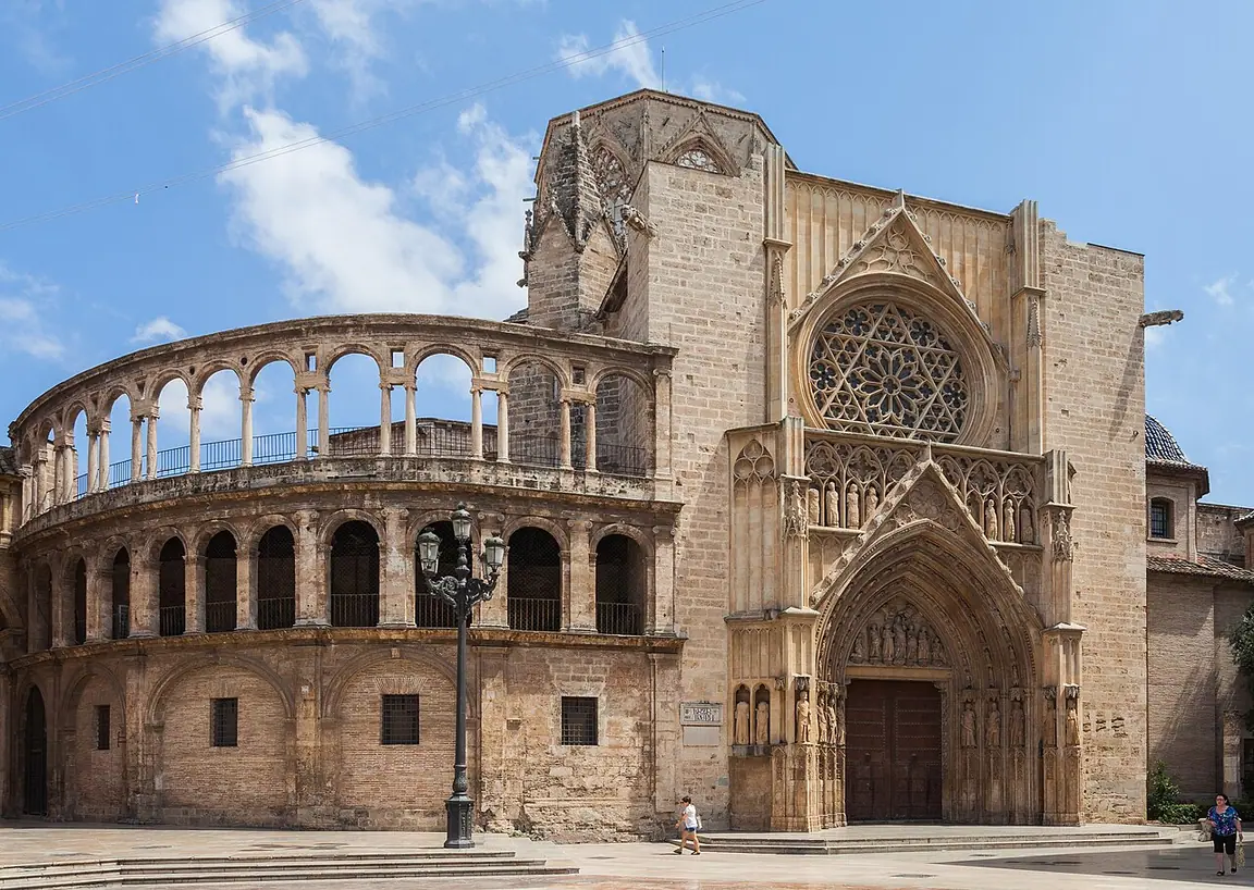 The Gothic Door of the Apostles and the adjoining arcaded gallery of Valencia Cathedral.