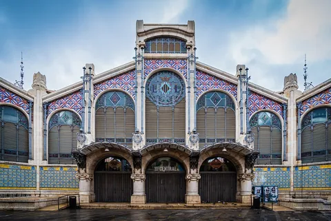 Decorated iron, glass and ceramic entrance facade of Valencia’s Central Market.