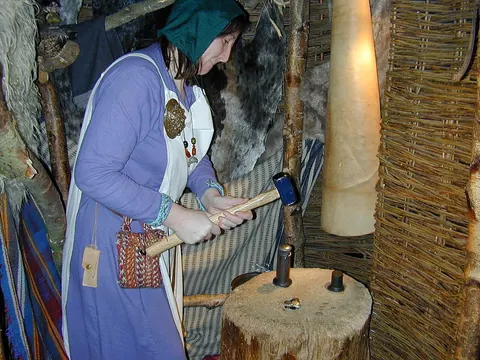 A costumed coin-making demonstration at JORVIK Viking Centre